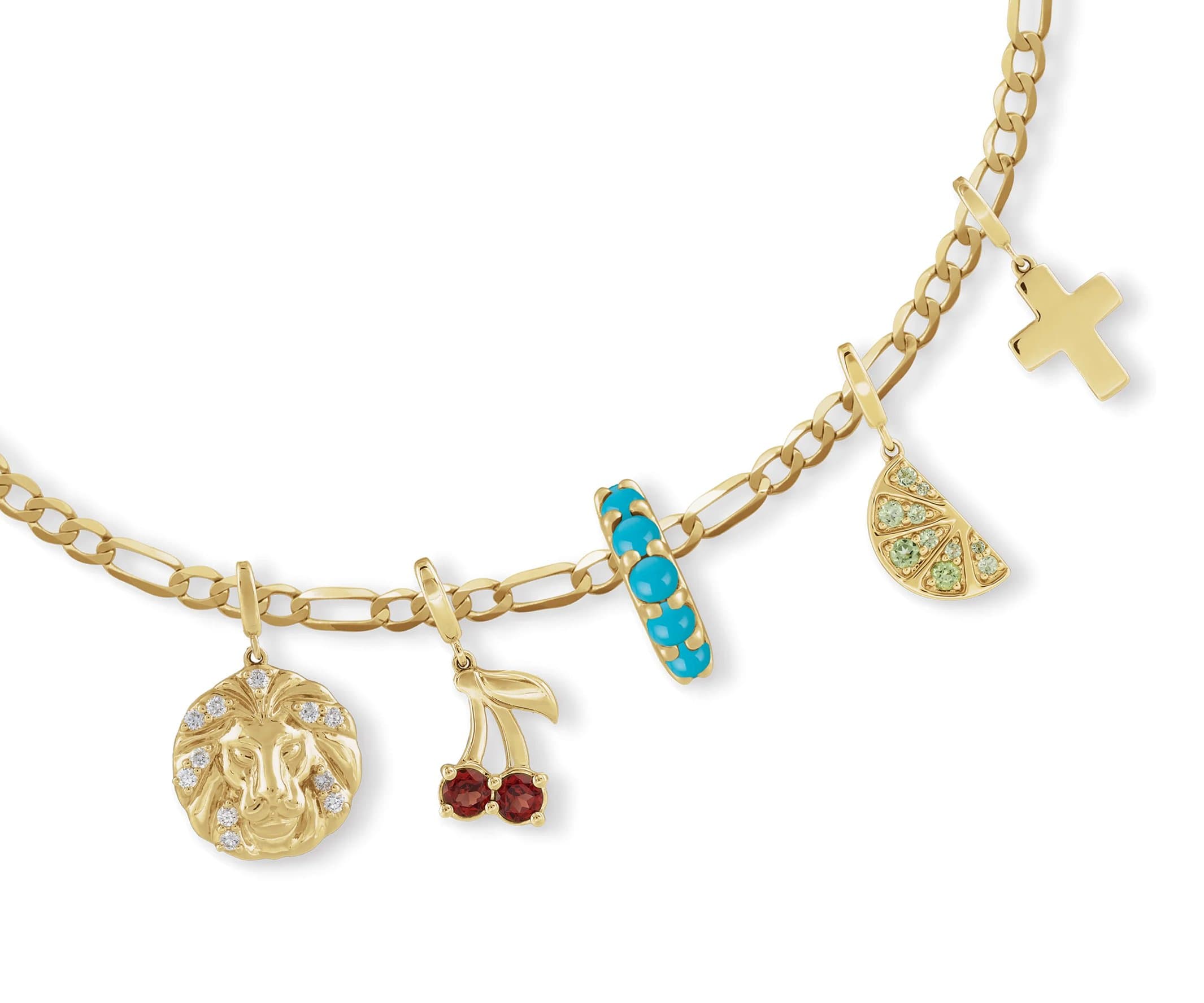 Yellow gold Figaro chain with lion, cherry, turquoise, fruit-slice, and cross charms