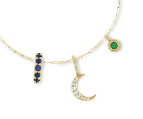Yellow gold paperclip chain with bar, crescent moon, and bezel charms